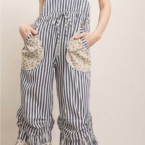 Floral Pocket Striped Jumpsuit- P2P 22’; hips 26’ Inseam 26’; Length- bib 47’